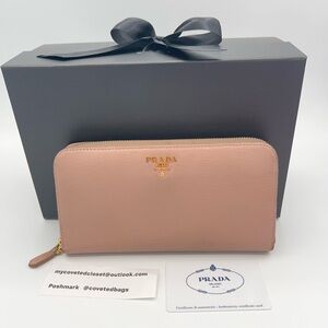 Large Prada zippy wallet in beige.